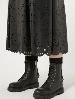 Gonna in tessuto spalmato